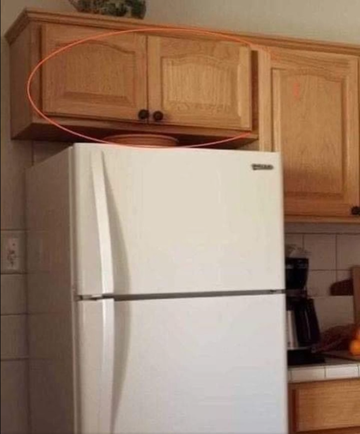 The Real Reason Cabinets Above the Fridge Exist